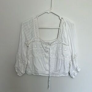 White American Eagle blouse top, puffy sleeves with lace and button details